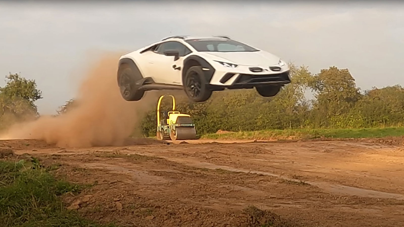 A white Lamborghini Huracan Sterrato jumping